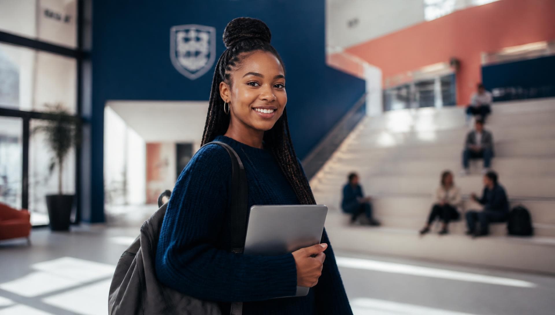 A SACOB student in the college atrium